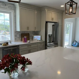 Custom gray kitchen cabinetry with center island