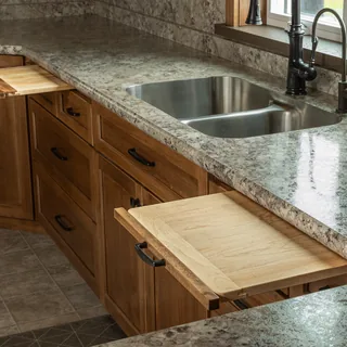 Corner cabinet with pull-out cutting boards