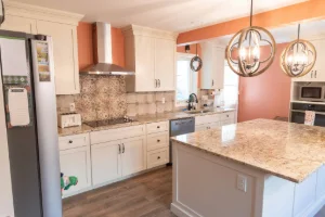 Full-service Amish kitchen renovation featuring a custom island and stone countertops in Chester Springs, PA