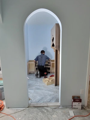 Arched doorway entry to custom prayer room being framed during construction in Downingtown, PA