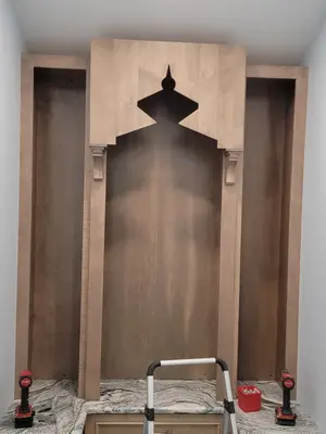 Custom prayer room shrine structure under construction with granite countertop and base cabinets in Downingtown, PA