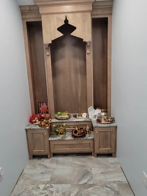 Completed custom wood prayer room shrine with arched canopy and marble altar counter in Downingtown, PA