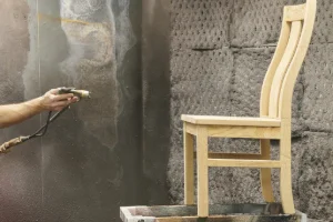 A custom-built wooden chair in the staining process